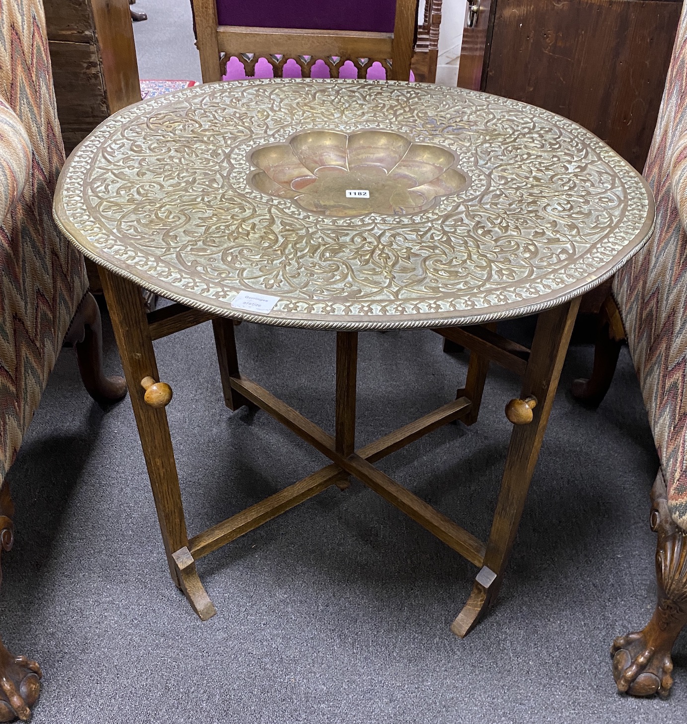 An Indian circular brass tray top table, diameter 76cm, height 59cm